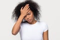 Upset young african woman touching forehead feeling headache Royalty Free Stock Photo