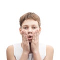 Upset young boy in a sleeveless shirt Royalty Free Stock Photo