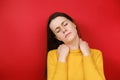 Upset young woman feeling stiff sore neck pain concept rubbing massaging tensed muscles suffer from fibromyalgia Royalty Free Stock Photo