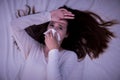 Upset young woman suffering from influenza at home Royalty Free Stock Photo