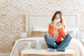 Upset young woman suffering from influenza at home Royalty Free Stock Photo