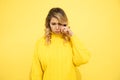 Upset young woman on yellow background, sadness, upset sad female person warried, try to cry. Studio shot. Facial Expression of Royalty Free Stock Photo