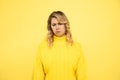Upset young woman on yellow background, sadness, upset sad female person warried, try to cry. Studio shot Royalty Free Stock Photo