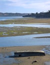 Upside down boat on a beach in low tide Royalty Free Stock Photo