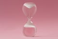 Upside-down hourglass on pink background - Concept of reverse time