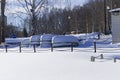 Upside-down snow-covered boats