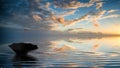 Upside down umbrella floating on stunning Winter sunset sky reflected in waves Royalty Free Stock Photo