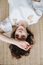 Upside portrait of a beautiful young woman in summer dress lying on the floor Royalty Free Stock Photo