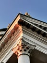 Upside view of a clasical building exterior with a column