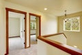 Upstairs hallway with staircase and carpet floor