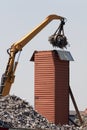 Upstanding cargo container getting loaded with metal scrap Royalty Free Stock Photo