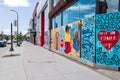 Uptown storefronts boarded up with graffiti Royalty Free Stock Photo