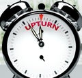Upturn soon, almost there, in short time - a clock symbolizes a reminder that Upturn is near, will happen and finish quickly in a Royalty Free Stock Photo