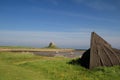 Upturned boats on Holy Island with view across the harbour Royalty Free Stock Photo