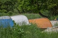 Upturned dinghies in tall grass Royalty Free Stock Photo