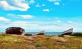 Upturned fishing boats on heath near shore Royalty Free Stock Photo