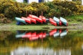 Upturned kayaks on shore of lake Royalty Free Stock Photo