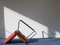 Upturned Office Chair Casting Shadow On Wall Royalty Free Stock Photo