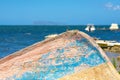 Upturned old boat on the sea. Royalty Free Stock Photo