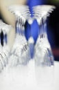 Upturned set of wine glasses on blurred blue Royalty Free Stock Photo