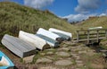 Upturned small rowing boats by a little bridge by the coast at Eype in Dorset Royalty Free Stock Photo