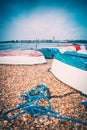upturned wooden fishing boats and ropes on a sea shore Royalty Free Stock Photo