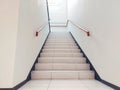 A upward angle view staircase with wooden handrail hand guard in house indoor