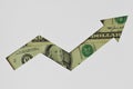 Upward arrow made of dollar banknotes on white background - Concept of upward trend of dollar currency