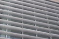 Upward view of attractive modern metal architectural louvers on a tall building Royalty Free Stock Photo