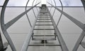 Upward view of a fire inspection ladder installed on the wall of a building or on chimneys. has a guide rope for tying the rope of