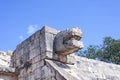 Upward view of the stone jaguar head statue at the Platform of the Eagles and Jaguars in Mayan Ruins of Chichen Itza, Mexico