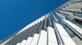 Upward view from street level of a tall modern office building exterior Royalty Free Stock Photo