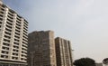 Upward View of Tall Residential Buildngs against Blue Sky