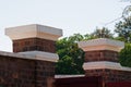 UPWARD VIEW OF WHITE PAINTED TOP OF PILLARS IN A FORT OPENING