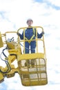 Upward view woman in bucket crane