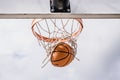 Basketball Swishing Down Through the Net Royalty Free Stock Photo