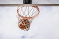 Basketball Falling Through the Net Royalty Free Stock Photo