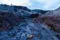 Ural Mars surreal alien landscape. Cracked dried-up bottom of clay pit and high mountains. Fantastic high mountains