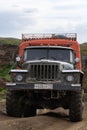 Ural - Russian off-road extreme expedition truck driving on mountain road transportation travelers in direction popular