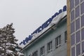 a large signboard covered with snow with the inscription Kazakhtelecom
