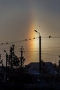 An unusual natural phenomenon is a halo, an atmospheric optical phenomenon around the sun in the early morning Royalty Free Stock Photo