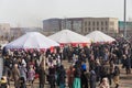 Nauryz holiday in Kazakhstan. Crowd of people and Kazakh yurts at the Nauryz holiday.