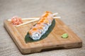 Uramaki. Philadelphia classic. Salmon, Philadelphia cheese, cucumber, avocado, tobiko Royalty Free Stock Photo