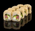Uramaki Sushi roll with tuna, cheese, avocado, chuka salad, seaweed and sesame isolated on black background with Royalty Free Stock Photo