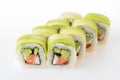 Uramaki tori sushi, a set of green rolls with cream cheese inside isolated on white. Eight pieces of sushi rolls.