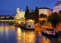 Urania Observatory building and Aspernbrucke at night, seen from Schwedenbrucke in Viena.