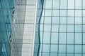 Urban abstract - Close-up of modern city glass curtain wall, windowed corner of office building Royalty Free Stock Photo