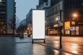 Urban advertising mockup, blank vertical outdoor billboard on city street Royalty Free Stock Photo