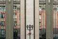 Urban architecture. Vertical mirrored windows of modern building and reflection of other building in it. Royalty Free Stock Photo