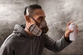 Urban artist wearing respirator mask